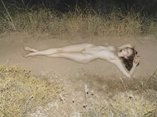 Woman found naked on the road...